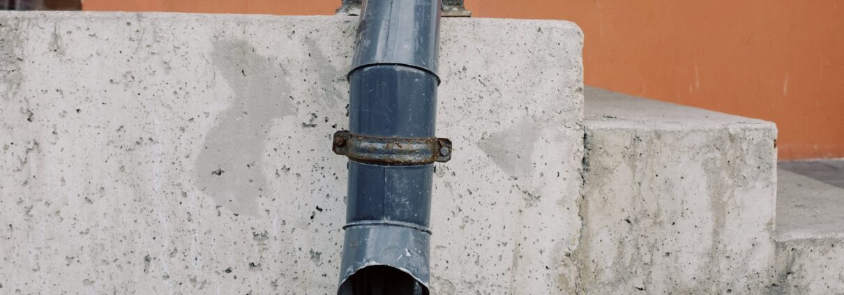 Picture of a leaking downspout.