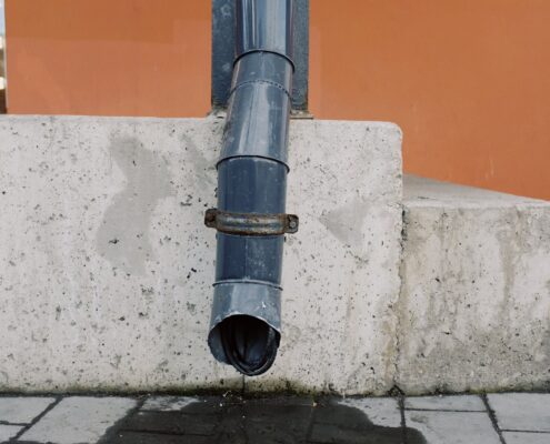 Picture of a leaking downspout.